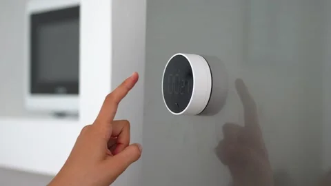 Close-up of turning off a chronometer or timer on a minimalistic black and white Stock Footage 219253424