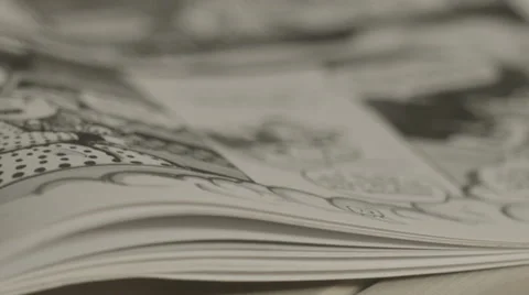 Close up of turning comic book pages Stock Footage 59049426
