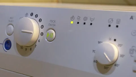 Close-up of turning on a washing machine with a Russian menu Stock Footage 151102287