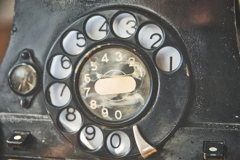Close-up of turning wheel of old-fashioned vintage rotary phone Foto stock