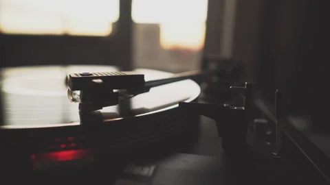 Close-up of a turntable needle playing a spinning vinyl record Stock Footage 291881490
