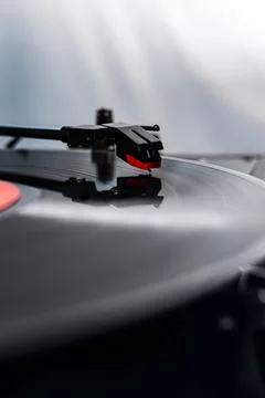 Close-up of a turntable needle playing a vinyl record Stock Photos