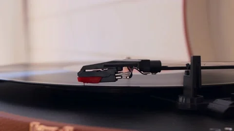Close-up of a turntable needle. The vinyl record spins in the turntable, the Stock Footage 194710637