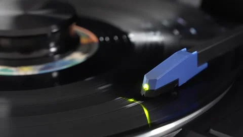 Close-Up of Turntable Tonearm Playing Vinyl Record Stock Footage 333757564