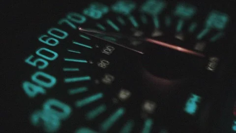 Close Up of Turquoise Illuminated Speedometer Showing Vehicle Speed On Dark.. Stock Footage 311793695
