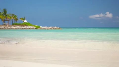 Close up of turquoise waves on the white sand of beautiful Api beach. Stone Stock Footage 272709464