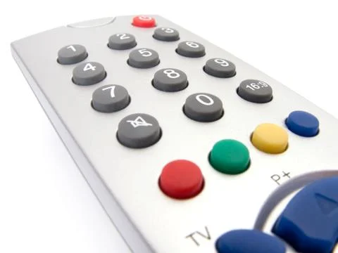 Close up of a tv remote control on white. Stock Photos