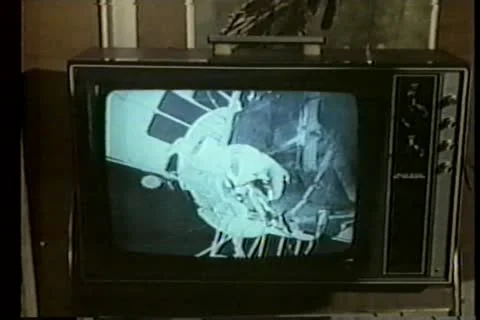 Close-up of TV screen broadcasting astronaut in space Vídeos de archivo 11353183