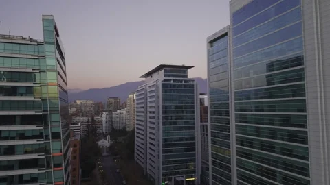 Close twilight drone pass between glass towers in Las Condes Santiago Chile Stock Footage 334637306