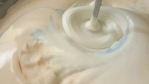 Close up of twist white cream spining in the blow Stock Footage 72666971