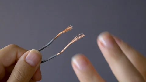 Close-up of twisting two wires. Splicing wires Stock Footage 114456312