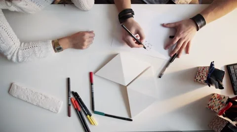 Close Up Of two Architects Discussing Plan Together At Desk timalaps Stock Footage 56949477