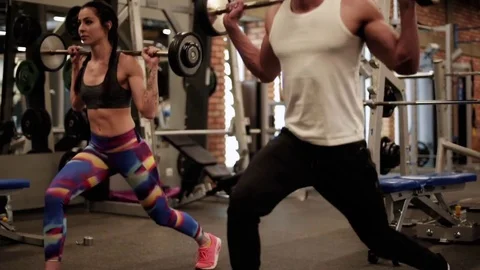 Close up of two athletes lifting barbells  Stock-Footage 84649306