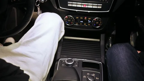 Close-up of two attractive young men talking inside the car. Two friends sitting Stock Footage 103716087