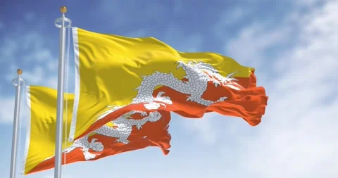 Close-up of two Bhutan national flags waving in the wind. Stock Footage 289851696