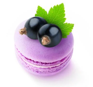 Close-up of two black currant berries on top of pink macaroon isolated on w.. Stock Photos