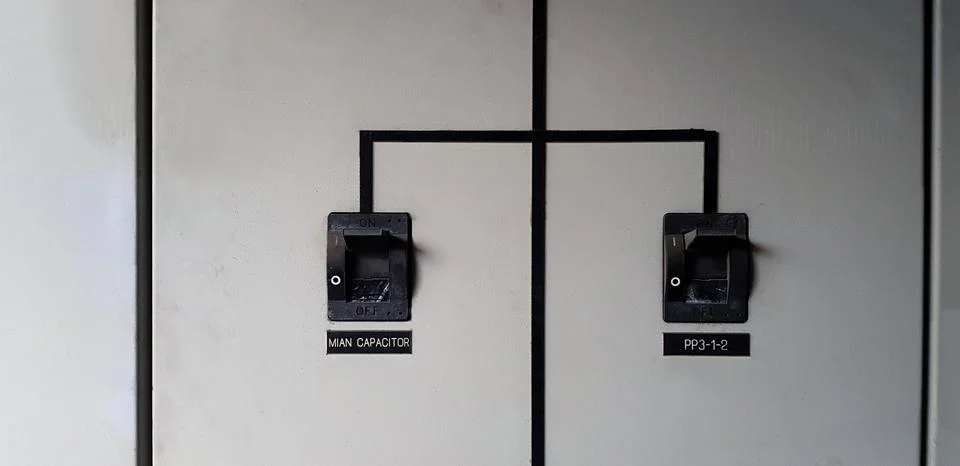 Close up Two black electrical main breaker connect  each other Stock Photos