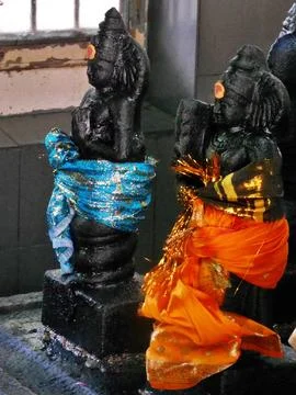 Close up of two black goddesses in temple, Trincomalee, Sri lanka. Stock Photos