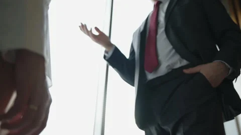 Close-up of two business partners shaking hands to signify an agreement. Stock Footage 199465959
