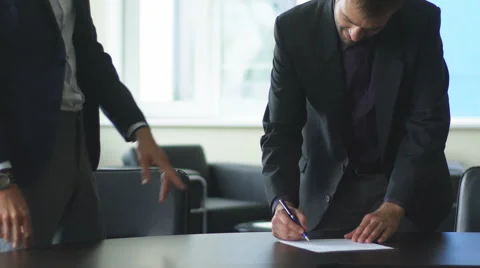 Close-up of two businessmen hands shaking Video stock 67941458
