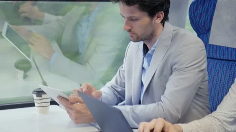 Close-up of two businessmen working efficiently on the train Stock Footage 67261815
