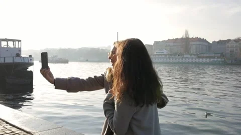 Close up of two cheerful stylish and friendly Caucasian and asian girls do a Stock Footage 135616913