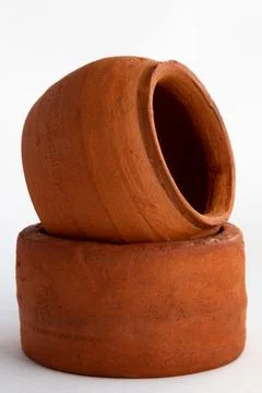 A close-up of two clay pots of two clay pots. Close-up of clay products. 스톡 사진