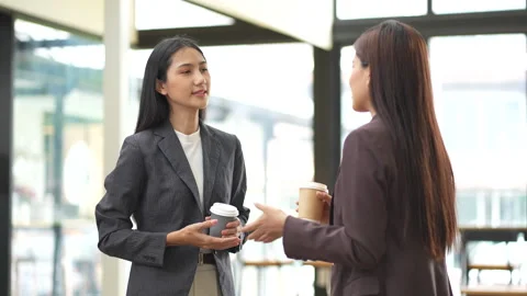 Close-up of two colleagues shaking hands in office, symbolizing agreement, Stock Footage 280816355