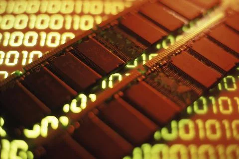 Close-up of two computer RAM chips on binary code Stock Photos