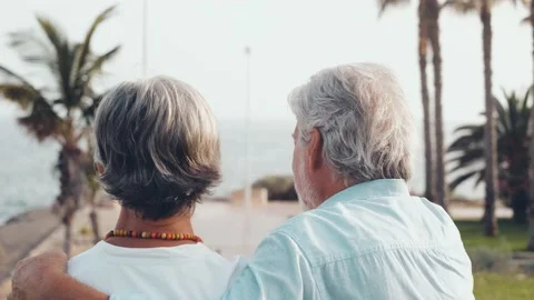 Close up of two cute and happy seniors having fun and enjoying together a sunset Stock Footage 204799866