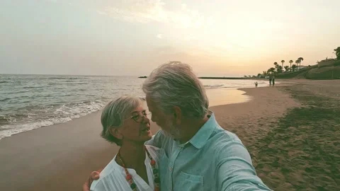 Close up of two cute and happy seniors having fun and enjoying together a sunset Stock Footage 204800933