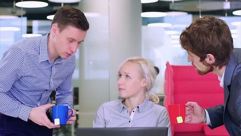 Close up of two cute colleagues take care of one girl Stock Footage 73525595