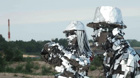 Close-up of two dancers in a shiny disco robot costumes made of mirrors Stock Footage 119523023