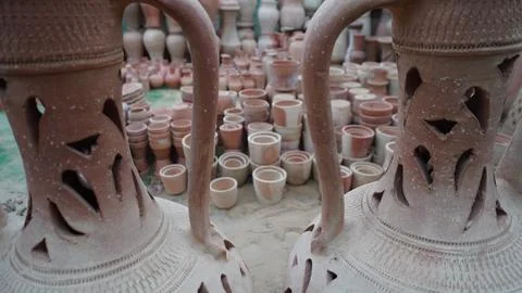 Close up of two decorated earthenware pitchers with stacks Stock Photos
