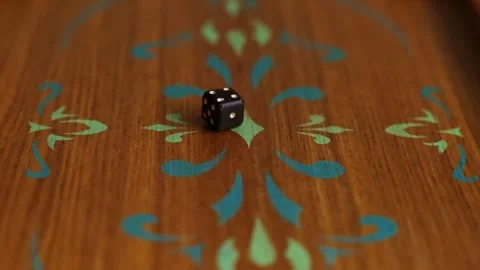 Close-up of two dices fall on the wooden backgammon board. Stock Footage 244506313