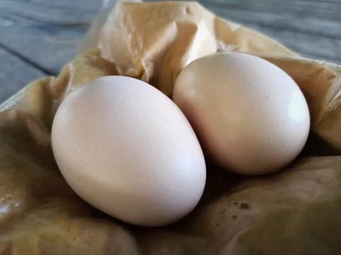 Close up of Two eggs are placed on the table. Stock Photos