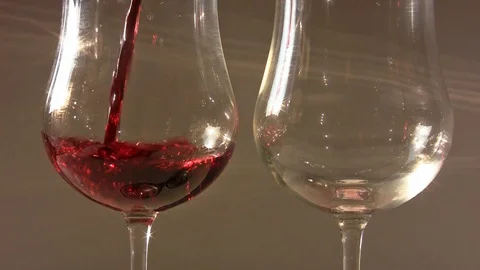 Close up of two elegant goblets filled with red wine 動画素材 107482942