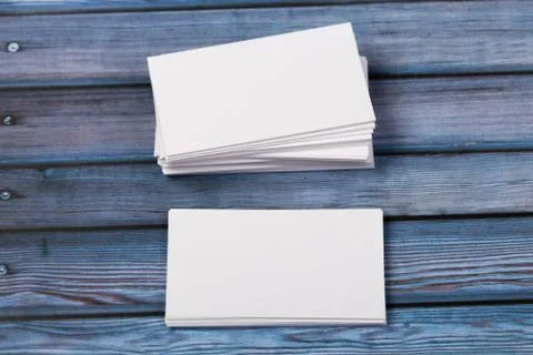 Close-up of two empty stacks of business cards on a blue-violet natural woode Stock Photos