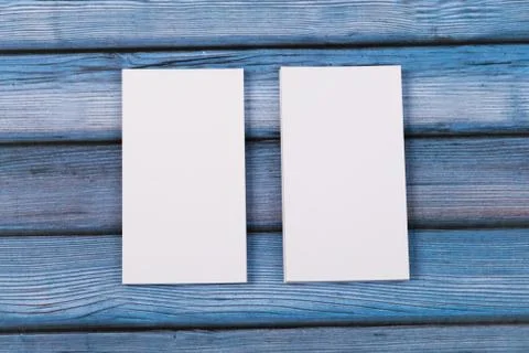 Close-up of two empty stacks of business cards on a blue-violet natural woode Stock Photos