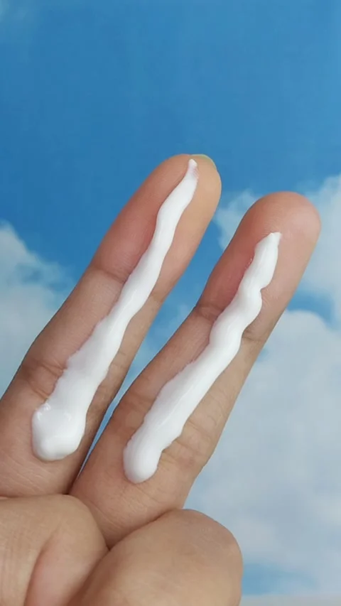 Close up of two fingers applying white cream on skin, soft texture skincare.. Stock Footage 331255111