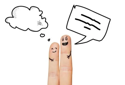 Close up of two fingers with communication clouds 库存照片