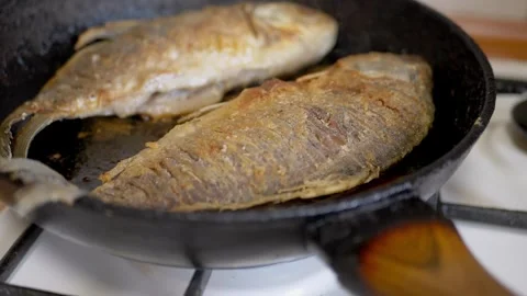 Close up, Two fish are frying in a pan Stock-Footage 314218087
