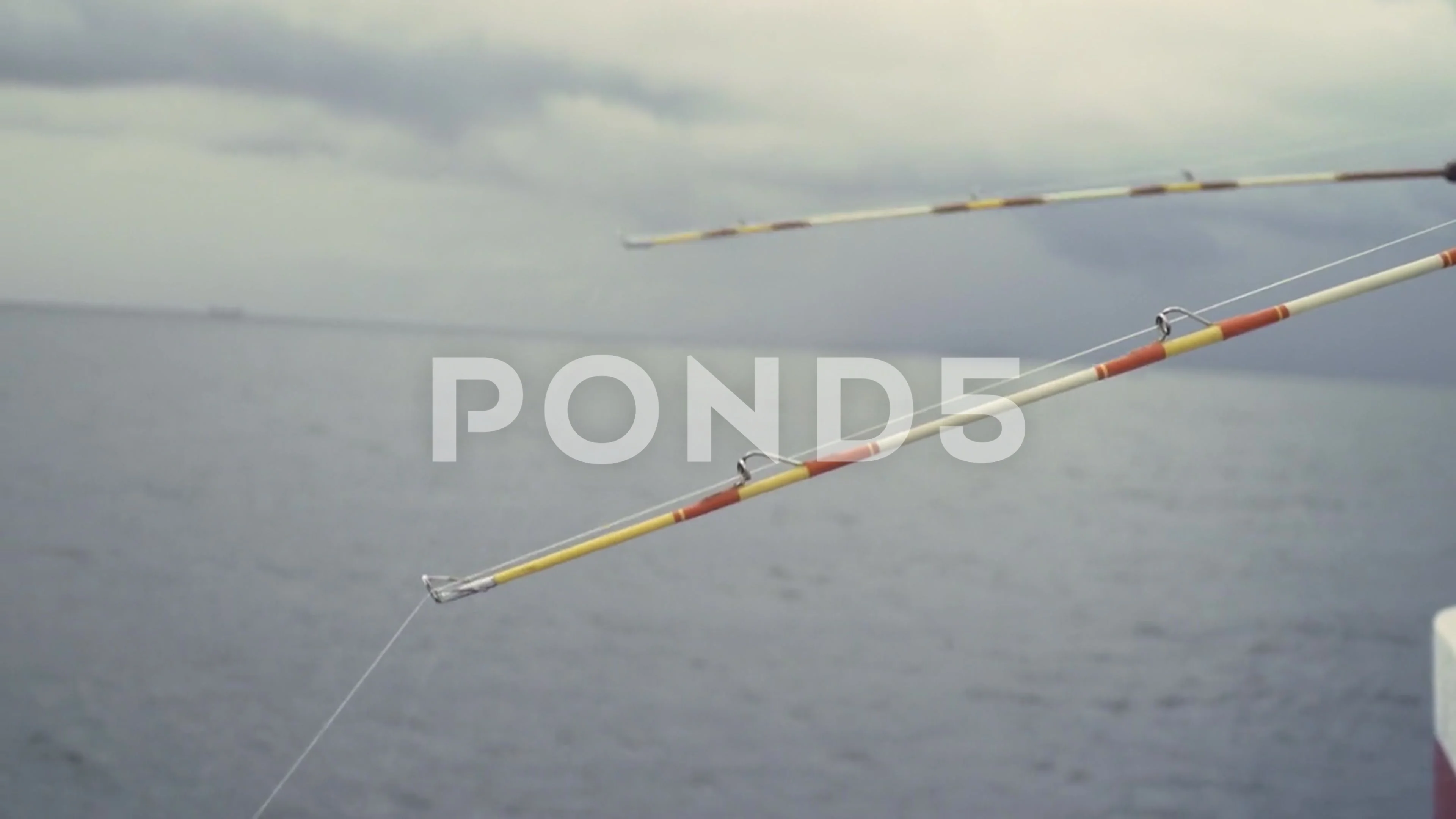 Close up of two fishing rods bent off th, Stock Video