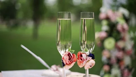 Close up of two glasses of champagne with bubbles stand on table Stock Footage 201291782