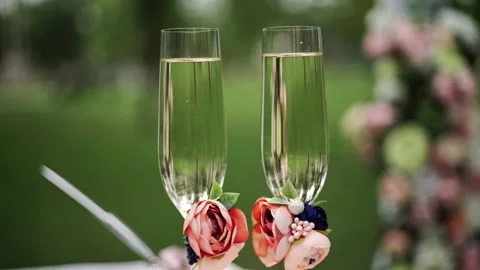 Close up of two glasses of champagne with bubbles stand on table Stock Footage 201291790