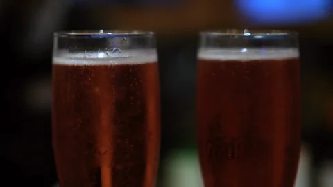 Close up of two glasses of red champagne Stock Footage 129395052