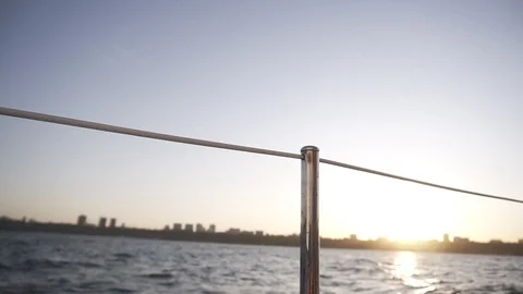 Close up of two glasses with wine or champagne on background of sea, sunlight Stock Footage 118962513