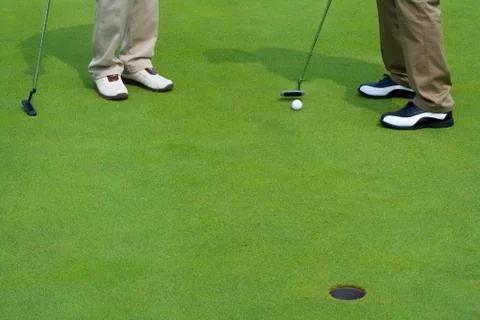 Close-up of two golfers Stock Photos