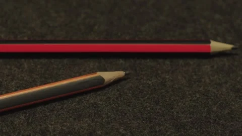 Close-up of Two Graphite Pencils on Dark Surface Stock Footage 333494830
