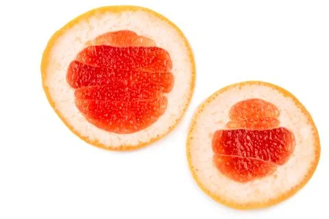 Close-up two halves of a delicious grapefruit isolated over the white background Stock Photos